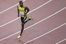 Jamaica's Usain Bolt reacts after competing in a heat of the men's 200 metres athletics event at the 2015 IAAF World Championships at the "Bird's Nest" National Stadium in Beijing on August 25, 2015