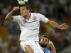 England's Carroll heads the ball as Italy's Nocerino looks on on during their Euro 2012 quarter-final soccer match at the Olympic Stadium in Kiev