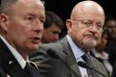 NSA director Alexander testifies next to Director of National Intelligence Clapper at a House Intelligence Committee hearing in Washington
