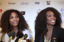 U.S tennis players Serena Williams and Venus Williams smile during a news conference in Lagos