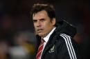 Wales's manager Chris Coleman watches the warm up before the international friendly football match between Wales and Netherlands at Cardiff City Stadium in south Wales on November 13, 2015
