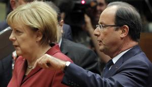 French President Francois Hollande, right, speaks with …