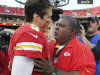 Kansas City Chiefs coach Romeo Crennel, right, talks with quarterback Brady Quinn (9) following an NFL football game against the Carolina Panthers at Arrowhead Stadium in Kansas City, Mo., Sunday, Dec. 2, 2012. The Chiefs defeated the Panthers 27-21. The win came one day after Chiefs' Jovan Belcher fatally shot his girlfriend and later turned a gun on himself as GM Scott Pioli and Crennel looked on. (AP Photo/Colin E. Braley)