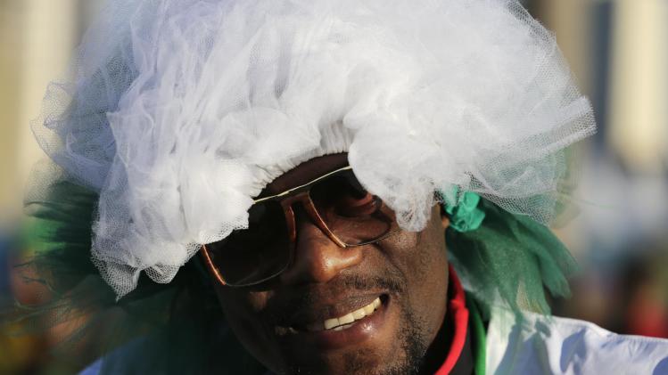 A Nigeria fan smiles as he arrives for the group F World Cup soccer match between Nigeria and Bosnia at the Arena Pantanal in Cuiaba, Brazil, Saturday, June 21, 2014. (AP Photo/Fernando Llano)