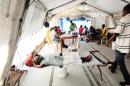 Haitians lay in clinic beds amid a resurgence of cholera on November 15, 2012