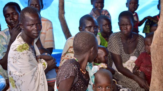 Internally displaced women and children pictured in a tent in Ganyiel village, in South Sudan&#39;s Unity State, on March 21, 2015