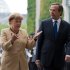 FILE - In this Aug. 24 2012 file picture  German Chancellor Angela Merkel, left, talks to Prime Minister of Greece Antonis Samaras, during a welcome ceremony at the chancellery in Berlin, Germany.  Germany's Chancellor Angela Merkel is to visit Greece next week as Athens works to convince its creditors to pay the next installment of its bailout package. Merkel's spokesman, Steffen Seibert, said the chancellor will meet Prime Minister Antonis Samaras in Athens on Tuesday.  Seibert said Friday Oct. 5, 2012  that Merkel's visit follows an invitation that Samaras made when he visited Berlin in August.  (AP Photo/dapd/Maja Hitij)