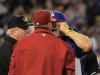 Los Angeles Dodgers batting coach Mark McGwire, right, yells at Arizona Diamondbacks manager Kirk Gibson after Los Angeles Dodgers' Zack Greinke was hit by a pitch during the seventh inning of their baseball game, Tuesday, June 11, 2013, in Los Angeles.  (AP Photo/Mark J. Terrill)