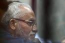 Muslim Brotherhood's Supreme Guide Mohamed Badie listens to lawyers during his trial with ousted Egyptian President Mohamed Mursi and other leaders of the brotherhood at a court on the outskirts of Cairo