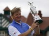 Ernie Els of South Africa holds up the Claret Jug after winning at the British Open golf championship at Royal Lytham & St Anne