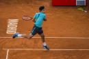 Roger Federer from Switzerland returns the ball during his Madrid Open tennis tournament match against Nick Kyrgios from Australia in Madrid, Spain, Wednesday, May 6, 2015. (AP Photo/Andres Kudacki)