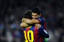 FC Barcelona's Luis Suarez from Uruguay, right, reacts after scoring with his teammate Lionel Messi from Argentina against Levante during a Spanish La Liga soccer match at the Camp Nou stadium in Barcelona, Spain, Sunday, Feb. 15, 2015. (AP Photo/Manu Fernandez)