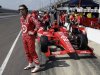 Dario Franchitti, of Scotland, waits next to his car during a break in a practice session on the second day of qualifications for the Indianapolis 500 auto race at the Indianapolis Motor Speedway in Indianapolis Sunday, May 19, 2013. (AP Photo/Tom Strattman)