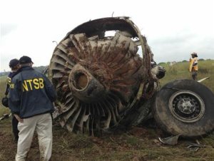 NTSB handout shows inspectors survey the wreckage of …