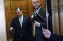 Sen. Ted Cruz, R-Texas, left, gets into an elevator following a vote on Capitol Hill in Washington, Wednesday, Oct. 9, 2013. President Barack Obama is making plans to talk with Republican lawmakers at the White House in the coming days as pressure builds on both sides to resolve their deadlock over the federal debt limit and the partial government shutdown. (AP Photo/Susan Walsh)