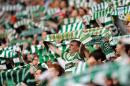 Celtic supporters sing before the Scottish Premier League football match at Celtic Park in Glasgow, Scotland