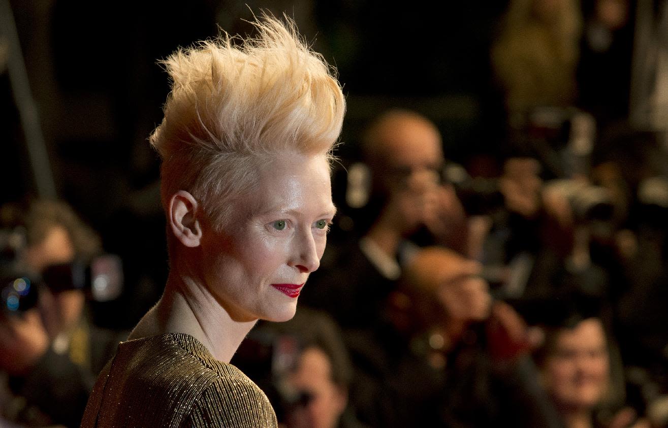 Actress Tilda Swinton poses for photographers as she arrives for the screen...