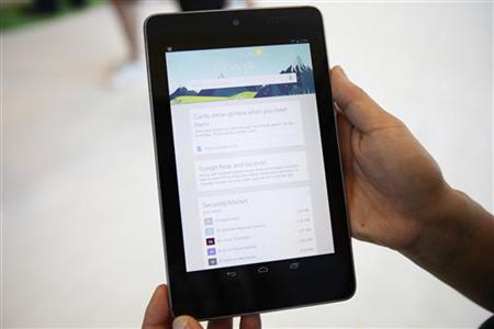 An attendee uses a Google Nexus 7 tablet during Google I/O 2012 Conference at Moscone Center in San Francisco