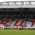 Supporters hold up coloured cards in memory of the victims of the Hillsborough disaster at Anfield in Liverpool