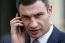 Ukraine opposition leader Klitschko, receives a phone call as he leaves the Elysee Palace in Paris