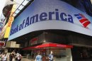Tourists walk past a Bank of America banking center in Times Square in New York