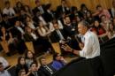 U.S. President Barack Obama listen a question from the audience during a town hall meeting with entrepreneurs as part of Obama's two-day visit to Argentina, in Buenos Aires