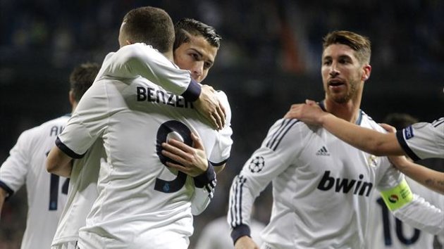 Real Madrid's Cristiano Ronaldo celebrates with Karim Benzema and team-mates (Reuters)