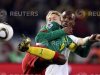 Denmark's Simon Kjaer fights for the ball with Cameroon's Samuel Eto'o during a 2010 World Cup Group E soccer match in Pretoria