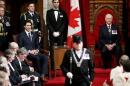 Canada's Governor General David Johnston (R) and Prime Minister Justin Trudeau look on prior to the delivery of the Speech from the Throne in the Senate chamber on Parliament Hill in Ottawa