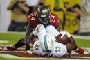 Tampa Bay Buccaneers outside linebacker Lavonte David (54) tackles Miami Dolphins running back Daniel Thomas (33) in the end zone for a safety during the second quarter of an NFL football game Monday, Nov. 11, 2013, in Tampa, Fla. (AP Photo/Brian Blanco)