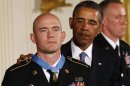 U.S. President Barack Obama awards Army Staff Sergeant Ty M. Carter, the Medal of Honor for conspicuous gallantry during a ceremony at the White House in Washington