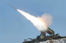 Rocket fired during drill of drones assaulting targets and a firing drill of flak rocket destroying cruise missiles in an undisclosed location in this KCNA picture, in Pyongyang