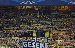 Borussia Dortmund's fans hold up scarves before the …