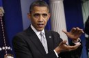U.S. President Obama gestures as he speaks to the media about the 