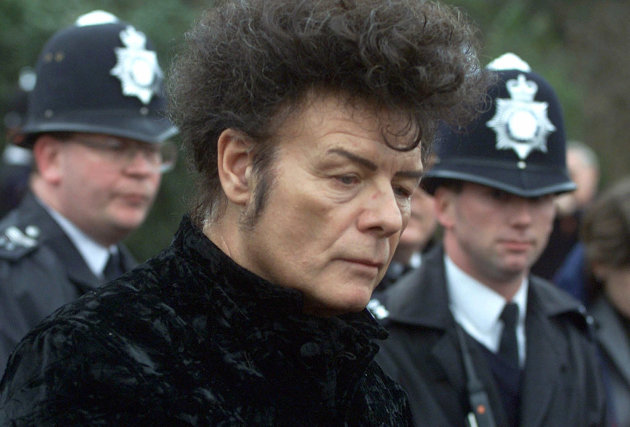 FILE - In this Jan, 11, 2000 file photo, British performer Gary Glitter, during a press conference in London. Police investigating the sex abuse scandal surrounding late BBC children's television host Jimmy Savile have arrested pop star Gary Glitter in connection with the case, British media said Sunday, Oct. 28, 2012. Metropolitan Police said they arrested a man in his 60s early Sunday morning at his London home, on suspicion of sexual offenses, and that he remains in custody in a London police station. (AP Photo/Alastair Grant, File)