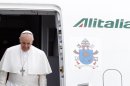 Pope Francis disembarks from the plane after landing from Rio de Janeiro, Brazil, at Ciampino's military airport, on the outskirts of Rome, Monday, July 29, 2013. The pontiff returned after a week in Brazil. (AP Photo/Riccardo De Luca)
