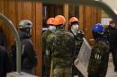 Pro-Russian protesters stand inside the seized regional administrative building in Kharkiv
