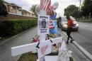 Forest,of Sanford, Florida, photographs a memorial for Trayvon Martin in Sanford