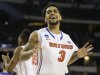Florida's Mike Rosario (3) reacts after beating Florida Gulf Coast 62-50 after a regional semifinal game in the NCAA college basketball tournament, Saturday, March 30, 2013, in Arlington, Texas. (AP Photo/Tony Gutierrez)