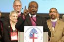 Bishop Michael Curry, of North Carolina, speaks after being elected the Episcopal Church's first African-American presiding bishop at the Episcopal General Convention Saturday, June 27, 2015, in Salt Lake City. Curry won the vote in a landslide. (AP Photo/Rick Bowmer)