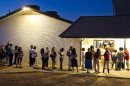 --FILE--People wait in line to vote at polling place located in a church in Phoenix in this Nov. 6, 2012, file photo. The Supreme Court ruled Monday, June 17, 2013, that states cannot on their own require would-be voters to prove they are U.S. citizens before using a federal registration system designed to make signing up easier. The justices voted 7-2 to throw out Arizona's voter-approved requirement that prospective voters document their U.S. citizenship in order to use a registration form produced under the federal "Motor Voter" voter registration law. (AP Photo/The Arizona Republic, Tom Tingle) MARICOPA COUNTY OUT; MAGS OUT; NO SALES