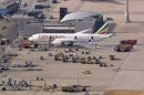 Emergency crew surrounds a Boeing 787 Dreamliner, operated by Ethiopian Airlines, which caught fire at Britain's Heathrow airport