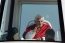 Pope Benedict XVI waves to the faithful from his Popemobile upon his arrival to conduct an open-air mass service at Beirut City Center Waterfront