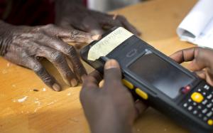 An elderly Nigerian woman validates her voting card &hellip;