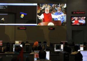 ISRO scientists and engineers watch PM Modi on screens after India&#39;s Mars orbiter successfully entered at their Spacecraft Control Center in Bangalore