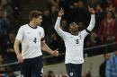 England's Daniel Sturridge, right, celebrates his goal against Denmark, with teammate Steven Gerrard, during the international friendly soccer match between England and Denmark at Wembley Stadium in London, Wednesday, March 5, 2014. (AP Photo/Sang Tan)