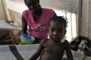 A girl receives treatment at a cholera treatment centre run by Doctors Without Borders, in Port-au-Prince
