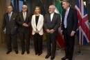 From left, French Foreign Minister Laurent Fabius, German Foreign Minister Frank-Walter Steinmeier, European Union High Representative Federica Mogherini, Iran's Foreign Minister Mohammad Javad Zarif and British Foreign Minister Philip Hammond stand for a group photo prior to a meeting in Brussels on Monday, March 16, 2015. European Union foreign ministers hold talks with Iran's top diplomat on Monday to try to advance an agreement on the Islamic Republic's nuclear program two weeks ahead of a deadline for an accord to be reached. (AP Photo/Virginia Mayo)
