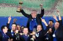 Europe players lift their captain Paul McGinley as he holds the trophy after winning the 2014 Ryder Cup golf tournament, at Gleneagles, Scotland, Sunday, Sept. 28, 2014. (AP Photo/Scott Heppell)