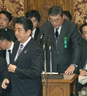 Japan's Prime Minister Shinzo Abe walks by public …